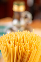 Pasta, table with pasta, ingredients and utensils, selective focus.