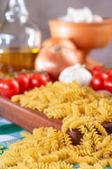 Pasta, table with pasta, ingredients and utensils, selective focus.