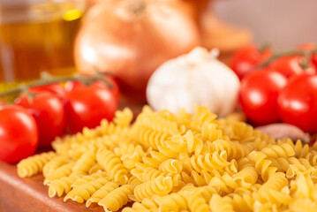 Pasta, table with pasta, ingredients and utensils, selective focus.