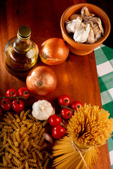 Pasta, table with pasta, ingredients and utensils, top view.