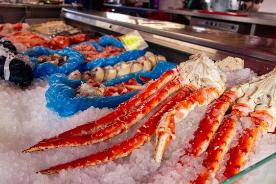 Legs of king crab (paralithodes camtschaticus) on ice in shop