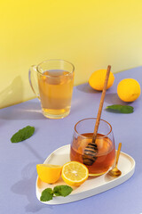 A natural remedy for colds and flu to boost immunity. A glass of tea, honey and lemon. 