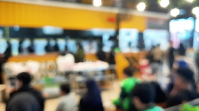Blurred background of restaurant with people.