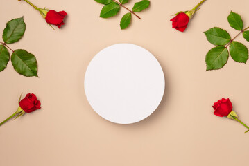 White round podium, pedestal product, presentation empty mockup on beige background with frame of red roses