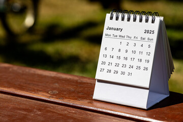 January 2025 paper calendar - month page on the wooden table
