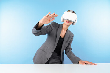 Project manager wearing VR headset and standing while holding innovation technology hologram....