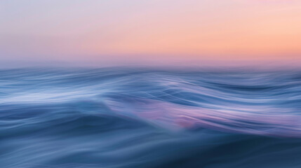 Obraz premium The image is of a calm ocean with a beautiful sunset in the background