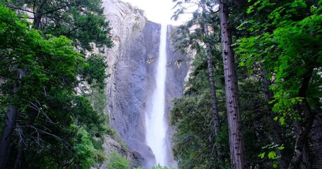 Bridalveil Fall waterfall and green trees in Yosemite National Park