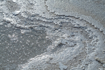 Formation of natural salt crystals on the salt lake Baskunchak. Astrakhan region, Russia
