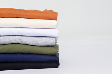 premium blank t-shirts, various colors, stacked, mockup, 100% cotton, basic collection, unbranded and unprinted