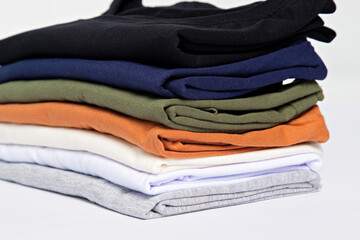 premium blank t-shirts, various colors, stacked, mockup, 100% cotton, basic collection, unbranded and unprinted