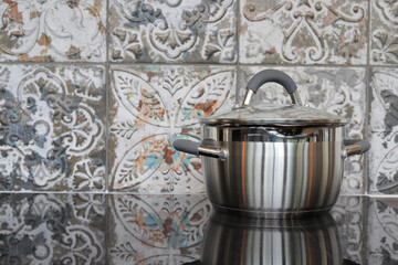 Metal pan on an electric stove close-up