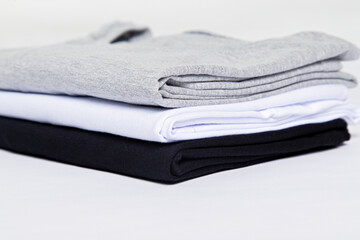 premium blank t-shirts, various colors, stacked, mockup, 100% cotton, basic collection, unbranded and unprinted