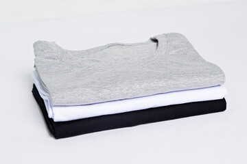 premium blank t-shirts, various colors, stacked, mockup, 100% cotton, basic collection, unbranded and unprinted