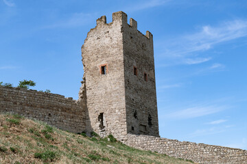 Ancient defensive tower of the ancient Genoese fortress on a sunny May day. Feodosia, Crimea