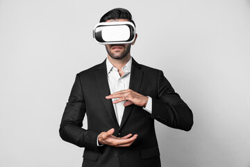 Smart business man with suit holding something while VR goggle to connect metaverse. Professional...