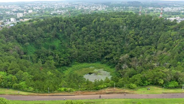 Aerial top view perspective of Trou Aux Cerf Volcano Curepipe in the tropical island jungle of Mauritius. Aerial view of Trou aux cerfs dormant volcano located at Curepipre, Mauritius