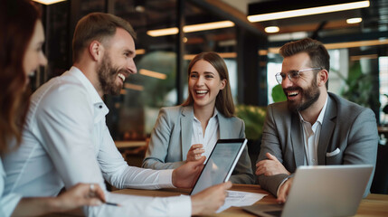 Three executives using laptop and tablet