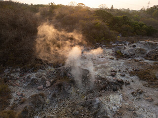 Aerial view of the steam coming out from the ground at sunset time at Los Ausoles - place in El...