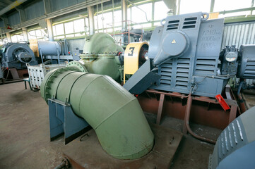 Water pumps and engines working in the hall of the floating pump station