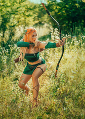 Art photo real person Fantasy woman elf warrior archer hunts in fairy tale mystery forest sun...