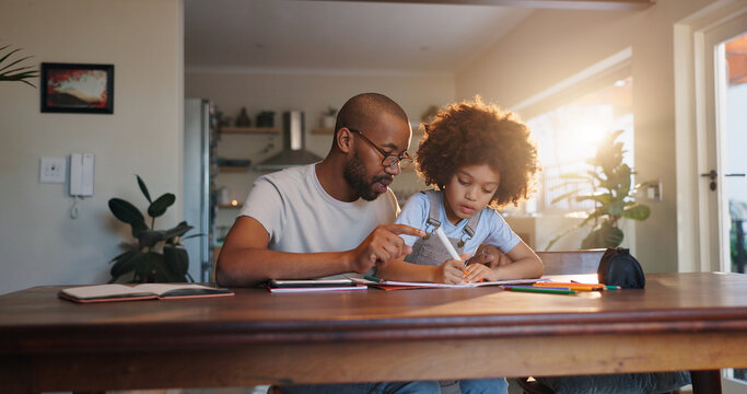 African man, child and homework book with helping hand, check and guide for progress in family house. Learning, father and son with support, care and notebook for education at apartment in Chicago