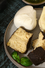 assorted cheeses for snacks on a board
