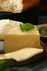 assorted cheeses for snacks on a board