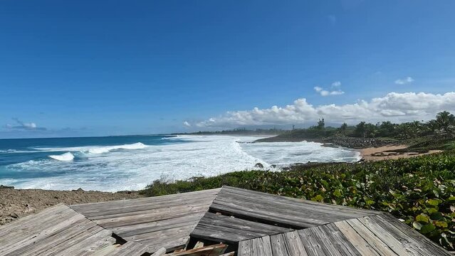 waves crashing on beach with wooden platform carolina puerto rico (tropical caribbean island vacation travel nature landscape)