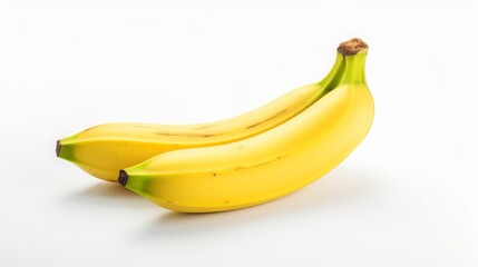 Two ripe bananas isolated on a white background. Fresh, healthy fruit for a balanced diet.