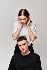 A man peacefully sits atop a womans head, their bodies intertwined, showcasing a unique and intimate connection between lovers.