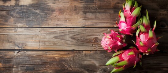 Close-up of dragon fruit on a wooden background, featuring ample copy space image.