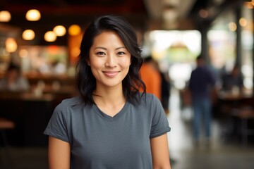 Portrait of a cheerful asian woman in her 30s wearing a sporty polo shirt on bustling restaurant background