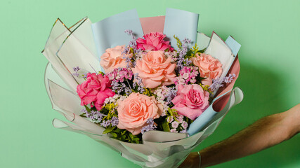 Bouquet of flowers isolated on green background