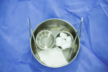 Dressing set for medical treatment.Surgical set and medical equipment on blue surgical tray inside operating room.Sterile surgical instrument tool equipment for surgery.Infection control