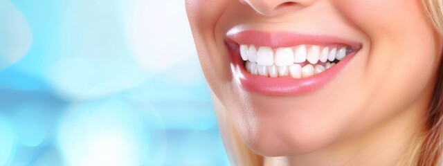 Fototapeta premium Close-up of a smiling woman's mouth with perfect white teeth, highlighting dental health and beauty. Concept of dental care, beauty, and happiness. 