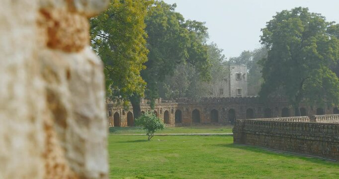 New Delhi, Delhi, India. Old wall surrounded Isa Khan's Tomb near The Humayun's tomb. Famous place is Tomb of Mughal emperor, Mirza Nasir al-Din Muhammad commonly known as Humayun situated in Delhi