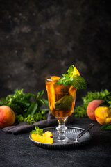 Cold ice tea with peach and mint