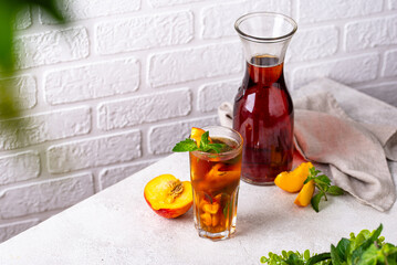 Cold ice tea with peach and mint
