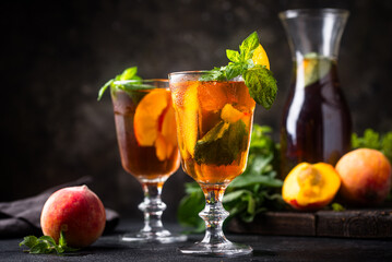 Cold ice tea with peach and mint
