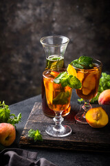 Cold ice tea with peach and mint