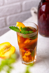 Cold ice tea with peach and mint