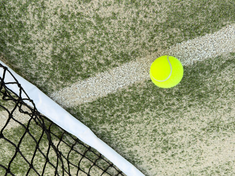 Tennis ball on grass tennis court