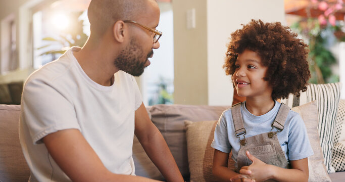 Father, child and couch in home, conversation and relax in living room for advice and bonding. Communication, support and love in lounge with dad person, chat and care from single parent boy on sofa