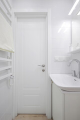 White interior door in the bathroom