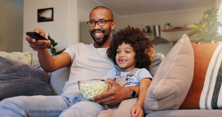 Dad, boy and happy with television or popcorn on sofa in living room for movies, cartoon and...