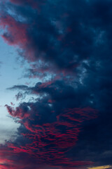 Dark dramatic sky with epic clouds sunset time