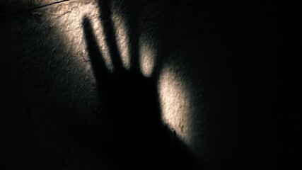 Shadow of hand on wall 