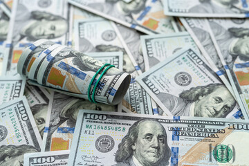 Finance background of new 100 dollar bills, pile of money. Us banknote