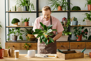 A man, a table, and a potted plant  a snapshot of a small business owner tending to his shop with...